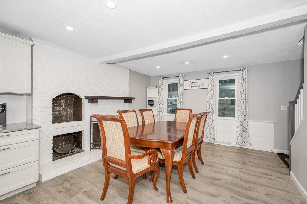 76 Maplewood Drive Townsend, MA 01469 - Photo 6 of 31 a view of a dining room with furniture and a fireplace