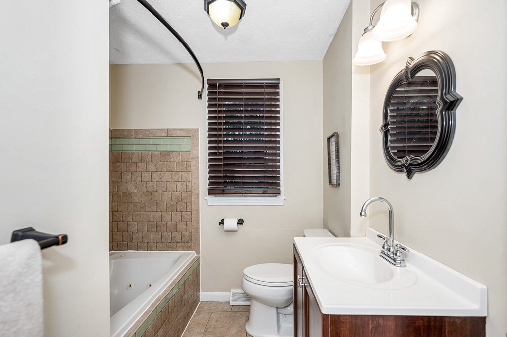 76 Maplewood Drive Townsend, MA 01469 - Photo 10 of 31 a bathroom with a sink a toilet and bathtub