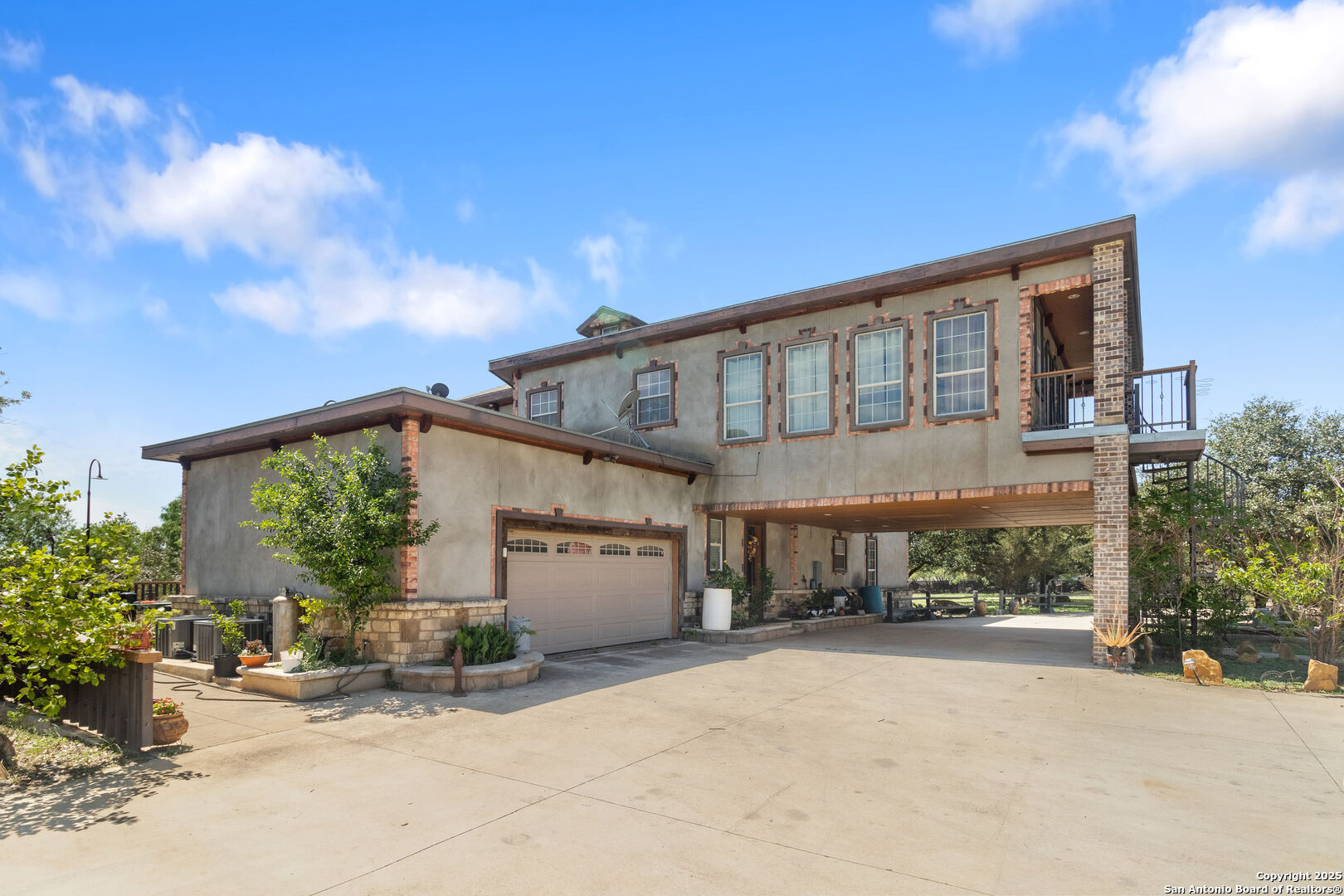 a front view of a house with sitting area