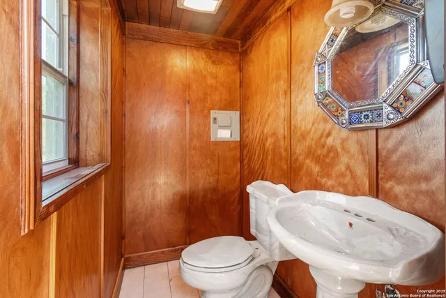 a bathroom with a toilet and a sink