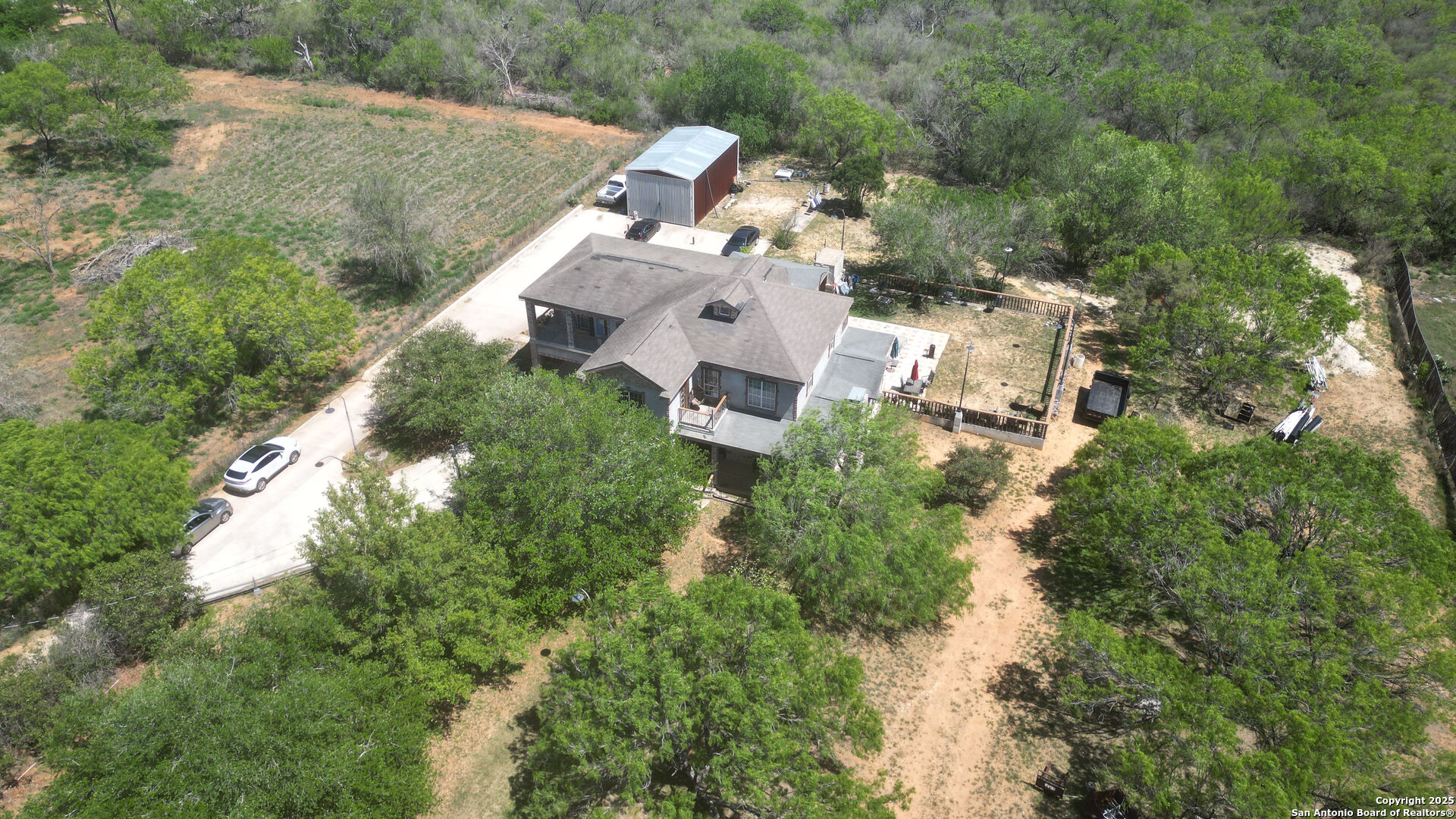19590 Leal Road San Antonio, TX 78221 - Photo 36 of 41 an aerial view of house with yard and outdoor seating