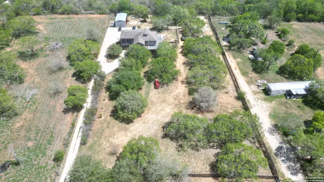 an aerial view of residential house with outdoor space