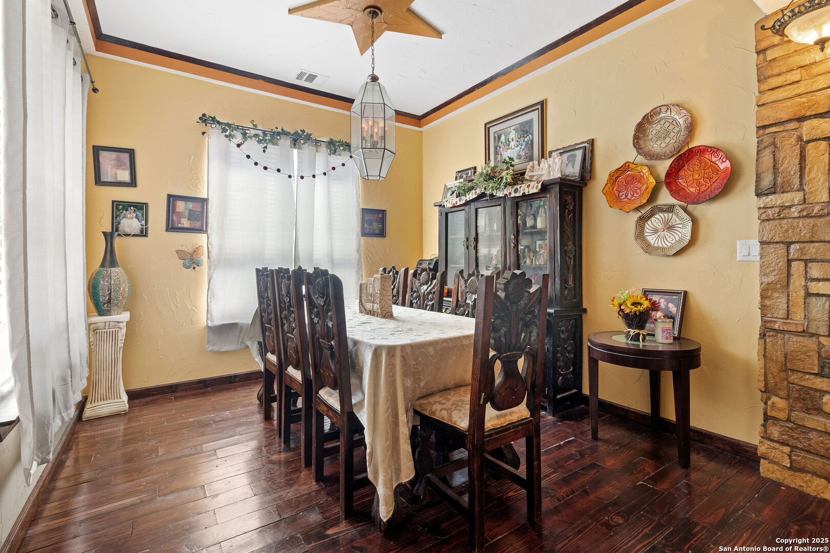 19590 Leal Road San Antonio, TX 78221 - Photo 10 of 41 a view of a dining room with furniture and wooden floor