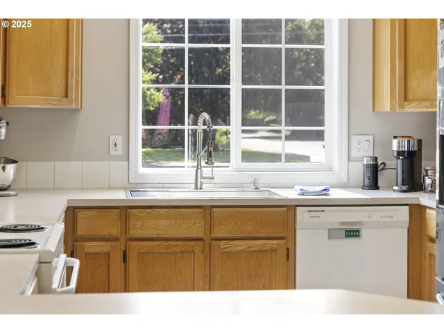 a kitchen with a refrigerator and a stove