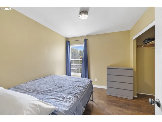 a bathroom with a sink toilet double vanity and shower