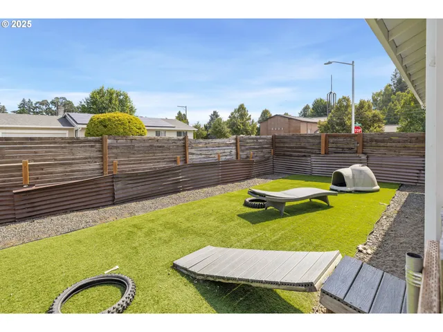 a view of a white house with a outdoor space