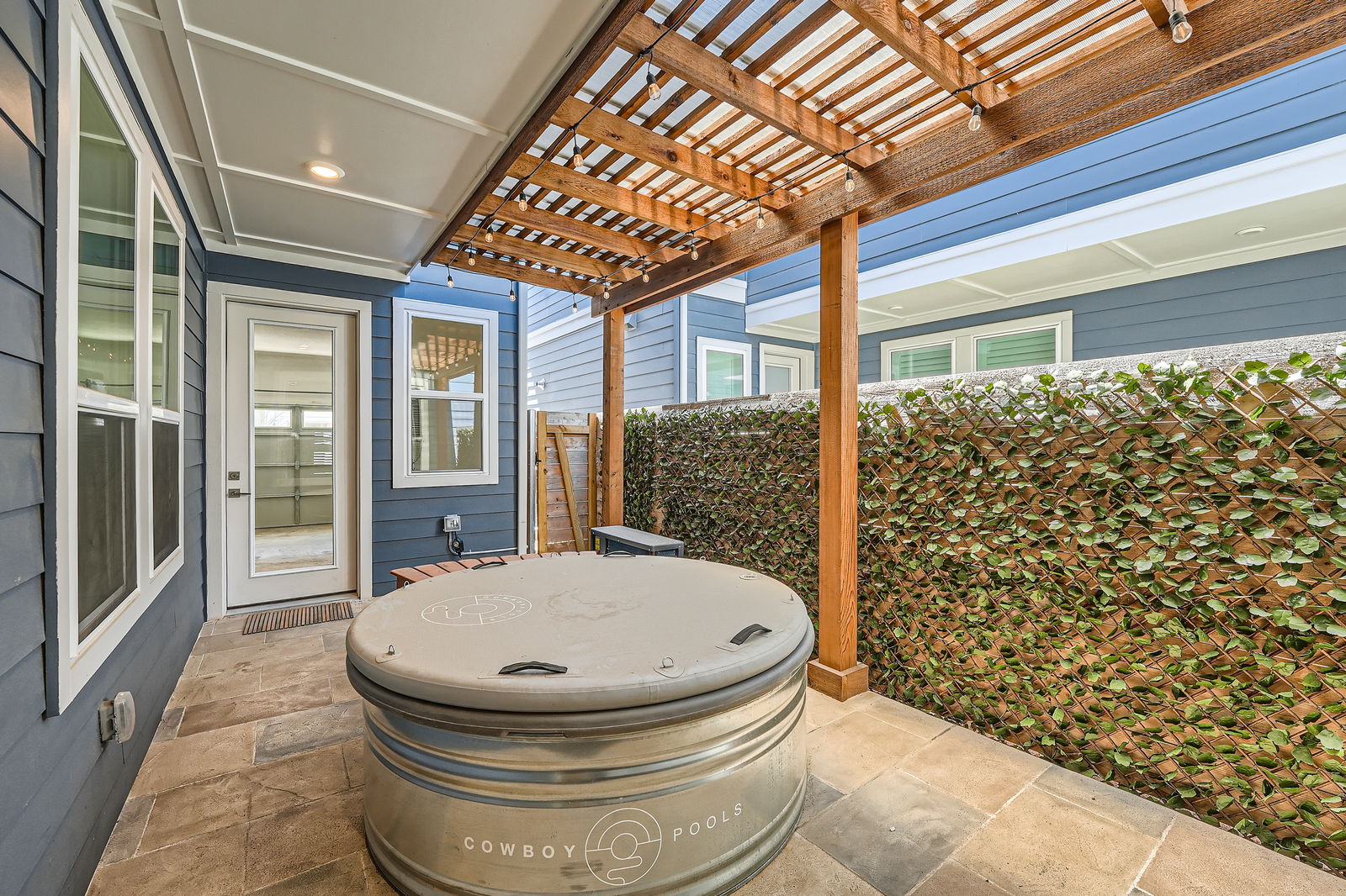 3213 Zach Scott Street Austin, TX 78723 - Photo 25 of 28 View of patio / terrace featuring fence and a pergola, and a professinally installed Cowboy sauna-pool!