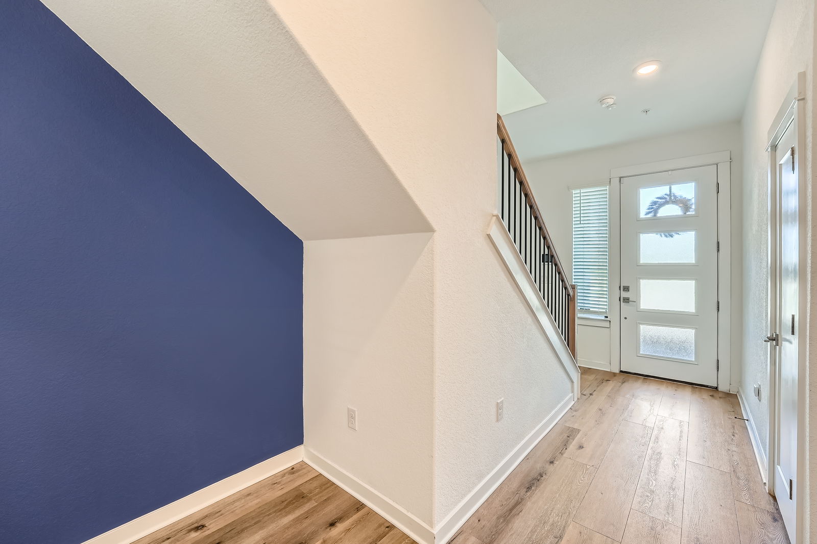 3213 Zach Scott Street Austin, TX 78723 - Photo 5 of 28 Foyer entrance featuring a wealth of natural light, baseboards, and hardwood / wood-style floors