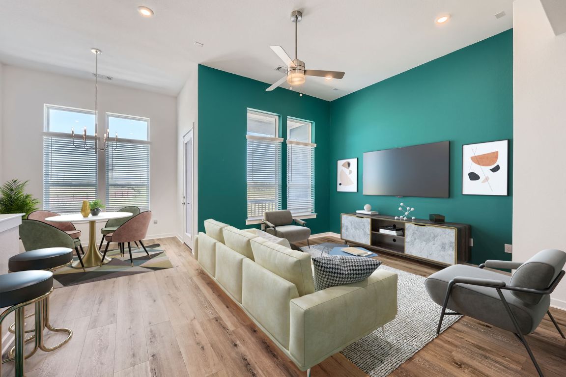 3213 Zach Scott Street Austin, TX 78723 - Photo 6 of 28 Living room featuring baseboards, recessed lighting, wood finished floors, and ceiling fan with notable chandelier