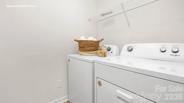 a view of storage and utility room with washer and dryer