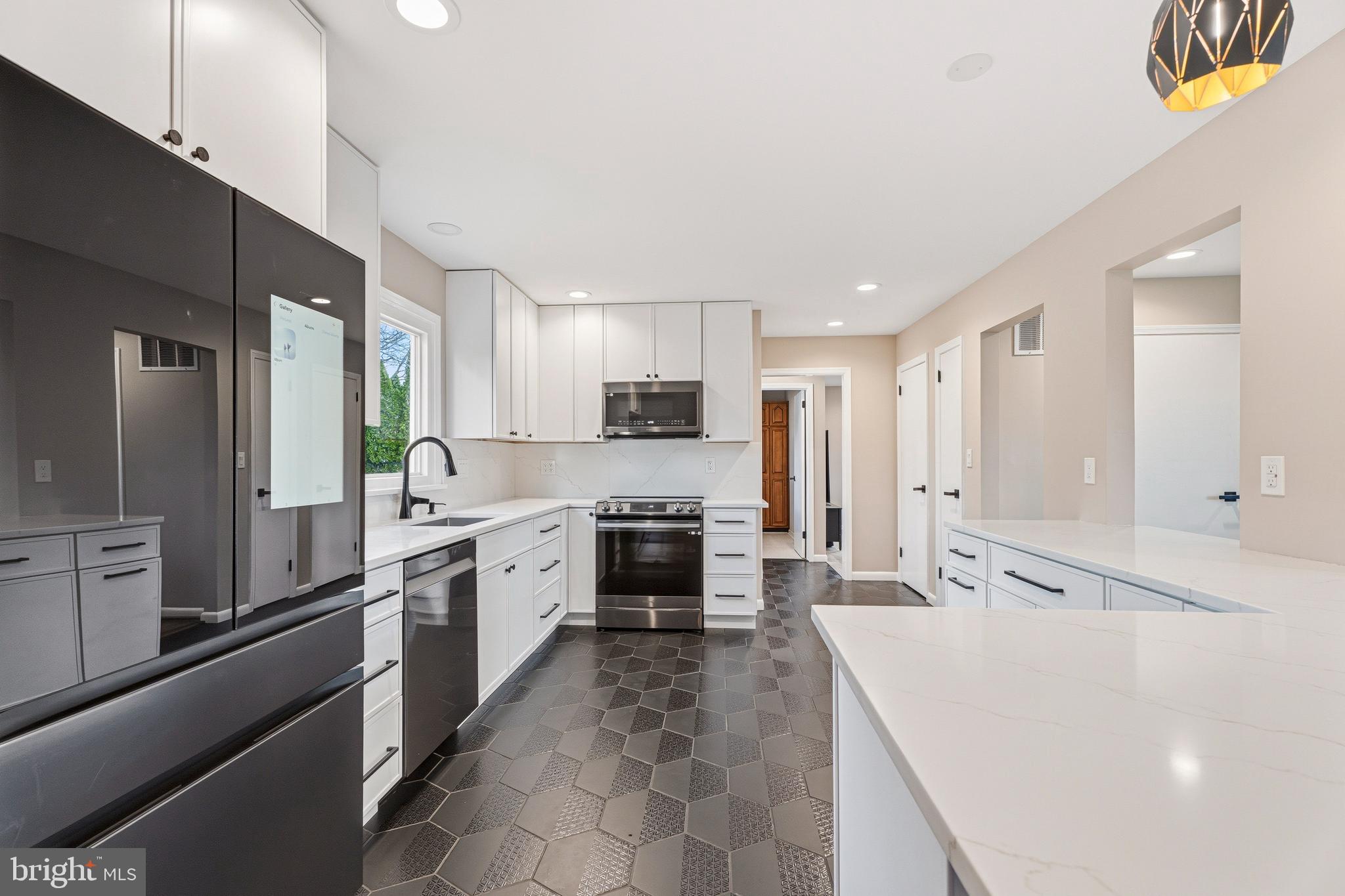 1211 Grafton Shop Road Bel Air, MD 21014 - Photo 12 of 42 a large kitchen with a large counter top stainless steel appliances and cabinets
