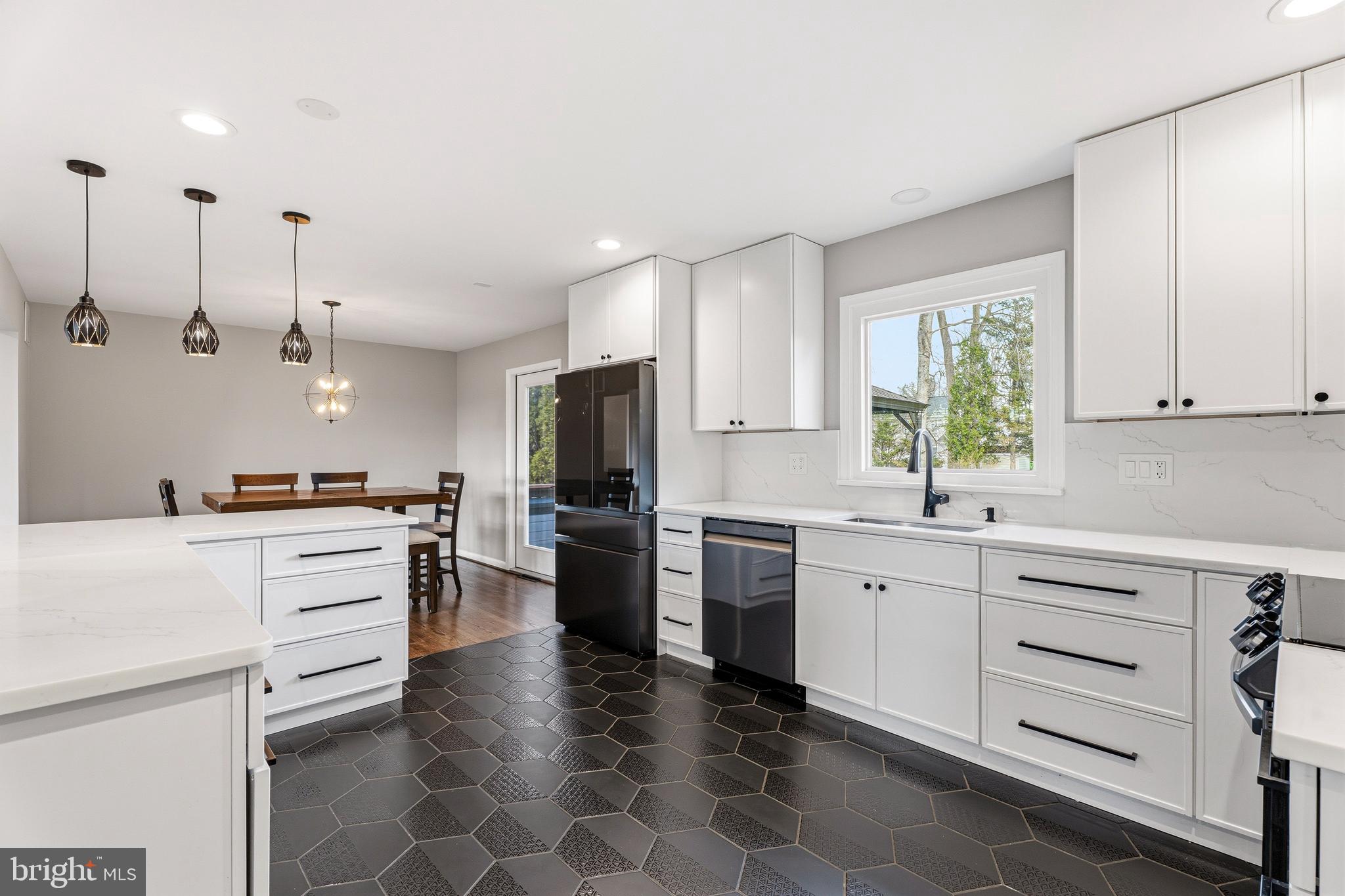 1211 Grafton Shop Road Bel Air, MD 21014 - Photo 13 of 42 a kitchen with a sink stainless steel appliances and cabinets