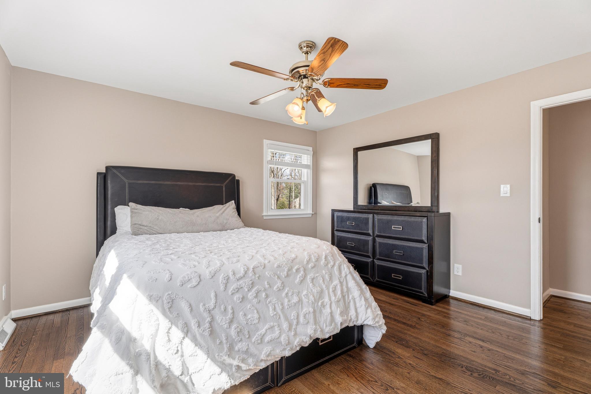 1211 Grafton Shop Road Bel Air, MD 21014 - Photo 28 of 42 a bedroom with a bed and a chandelier
