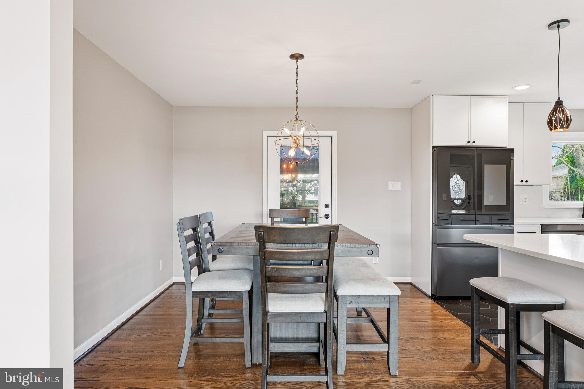 1211 Grafton Shop Road Bel Air, MD 21014 - Photo 10 of 42 a dining room with furniture a chandelier and wooden floor