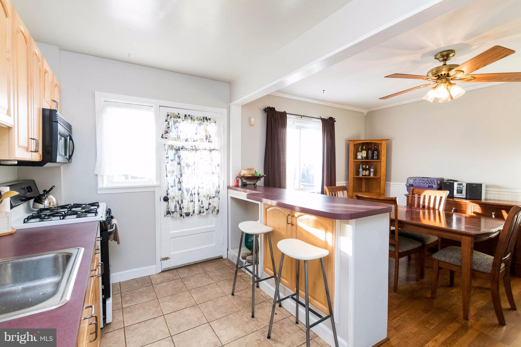2016 Ormand Road Baltimore, MD 21222 - Photo 14 of 26 a dining room with furniture and window