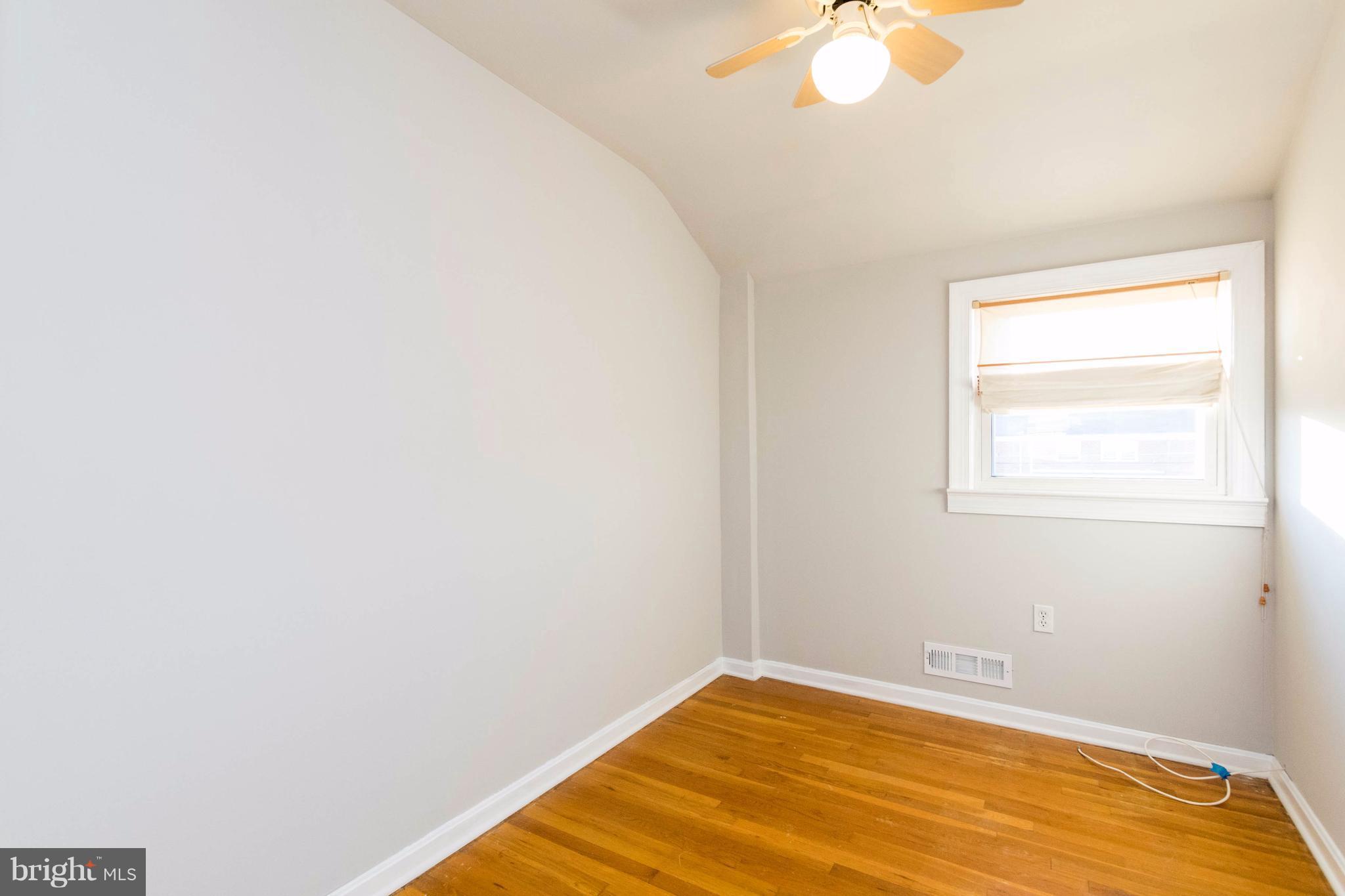2016 Ormand Road Baltimore, MD 21222 - Photo 23 of 26 a view of a room with a window and a ceiling fan