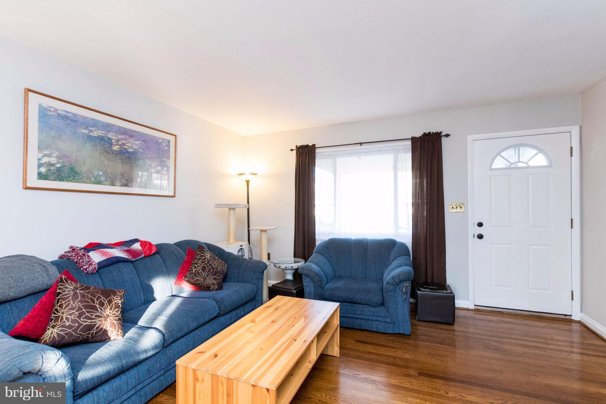 2016 Ormand Road Baltimore, MD 21222 - Photo 6 of 26 a living room with furniture and wooden floor