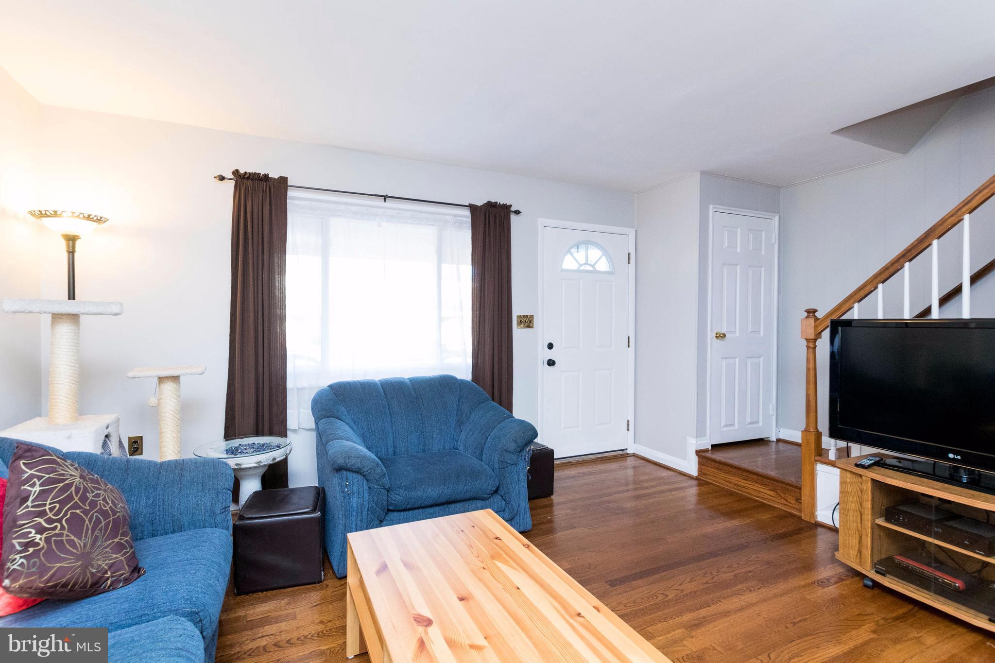 2016 Ormand Road Baltimore, MD 21222 - Photo 7 of 26 a living room with furniture and a flat screen tv