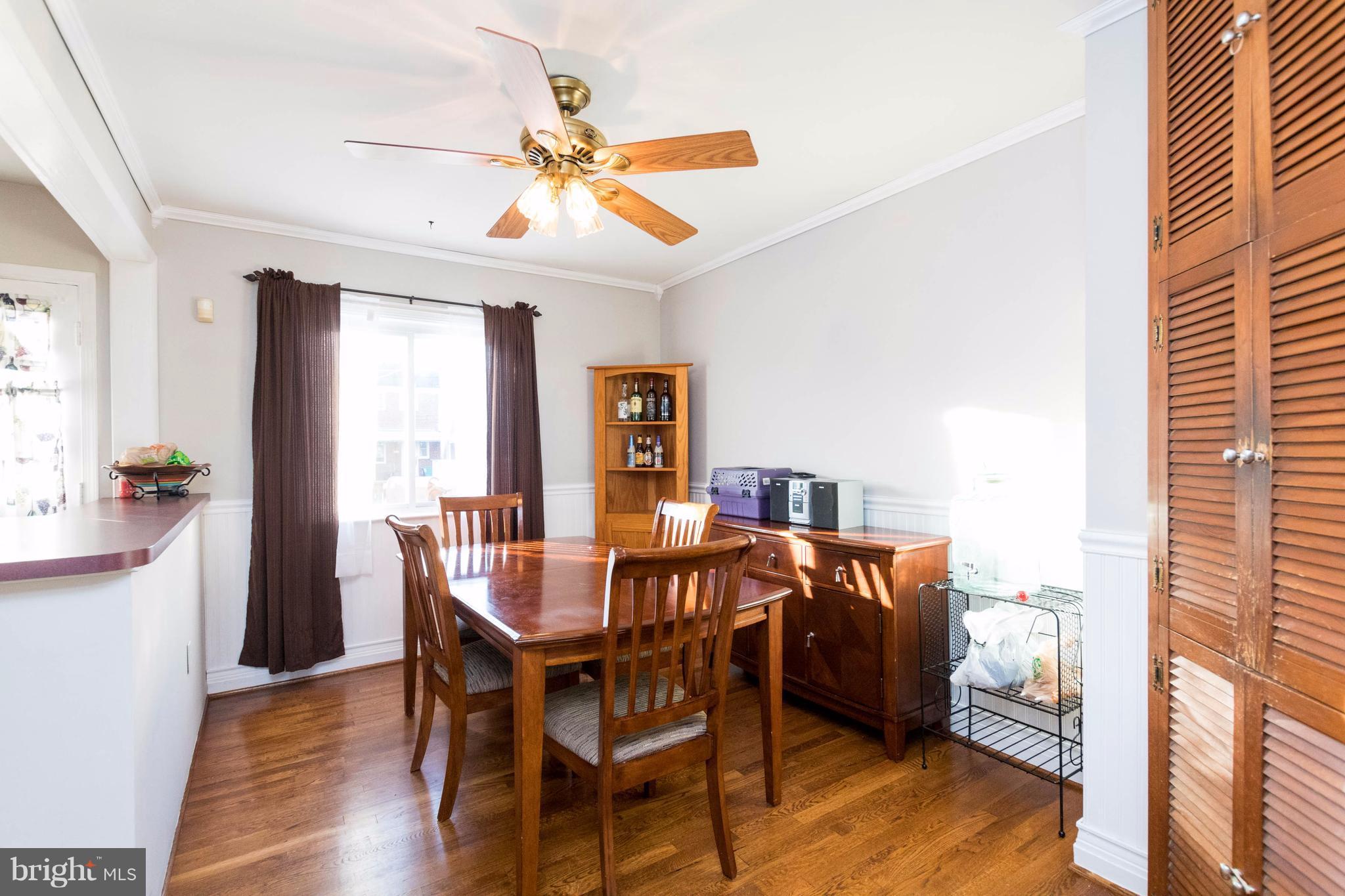 2016 Ormand Road Baltimore, MD 21222 - Photo 10 of 26 a view of a dining room with furniture window and wooden floor