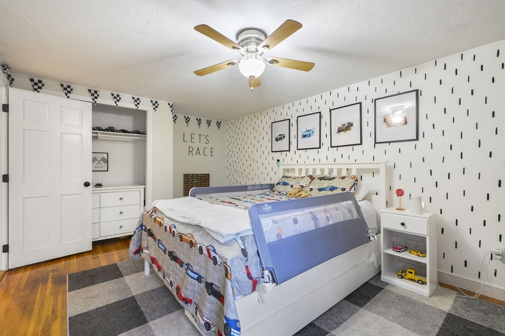 31 Indian Trail Hanson, MA 02341 - Photo 25 of 41 a bed room with a bed and a baby crib