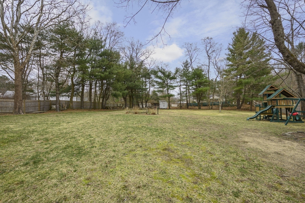31 Indian Trail Hanson, MA 02341 - Photo 35 of 41 a view of outdoor space with deck and trees