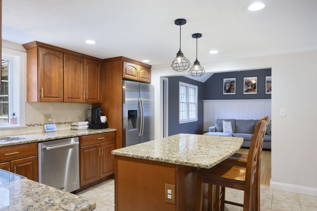 31 Indian Trail Hanson, MA 02341 - Photo 8 of 41 a kitchen that has a table chairs in it and wooden floors