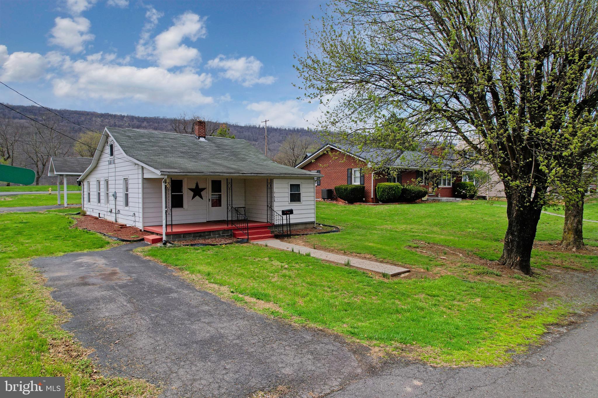 715 Charles Street Romney, WV 26757 - Photo 1 of 44 a view of a house with backyard porch and garden