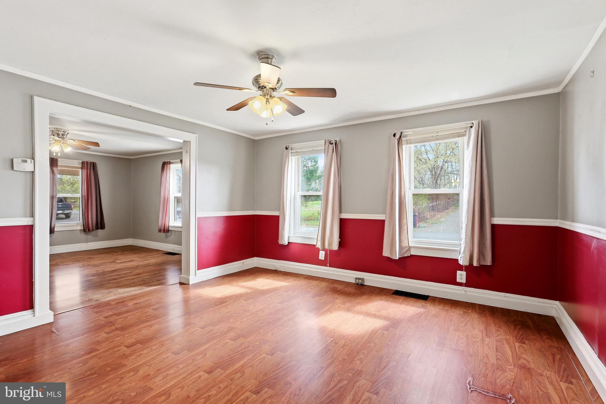 715 Charles Street Romney, WV 26757 - Photo 11 of 44 a view of empty room with wooden floor and fan