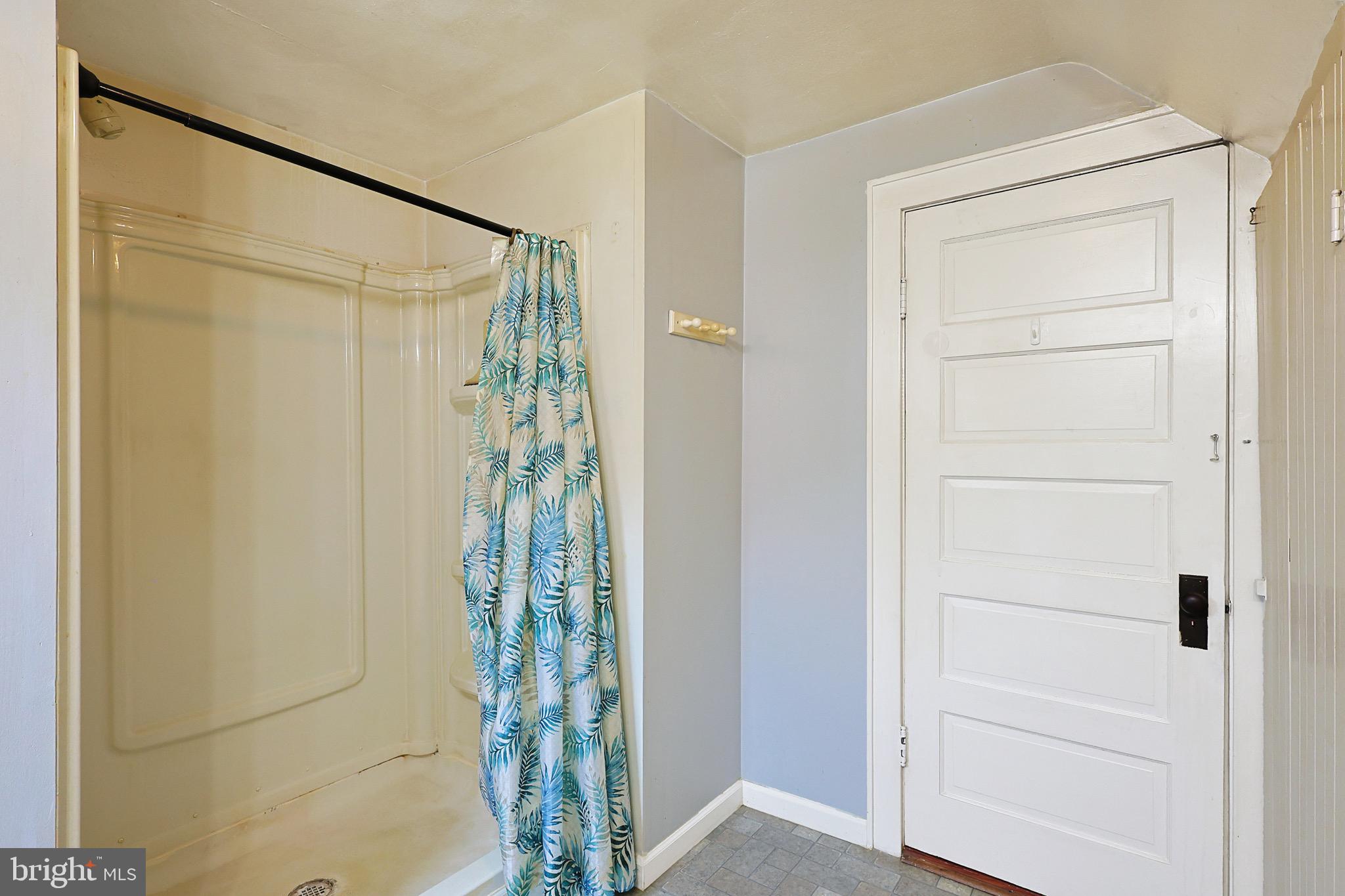 715 Charles Street Romney, WV 26757 - Photo 25 of 44 a bathroom with a glass shower door