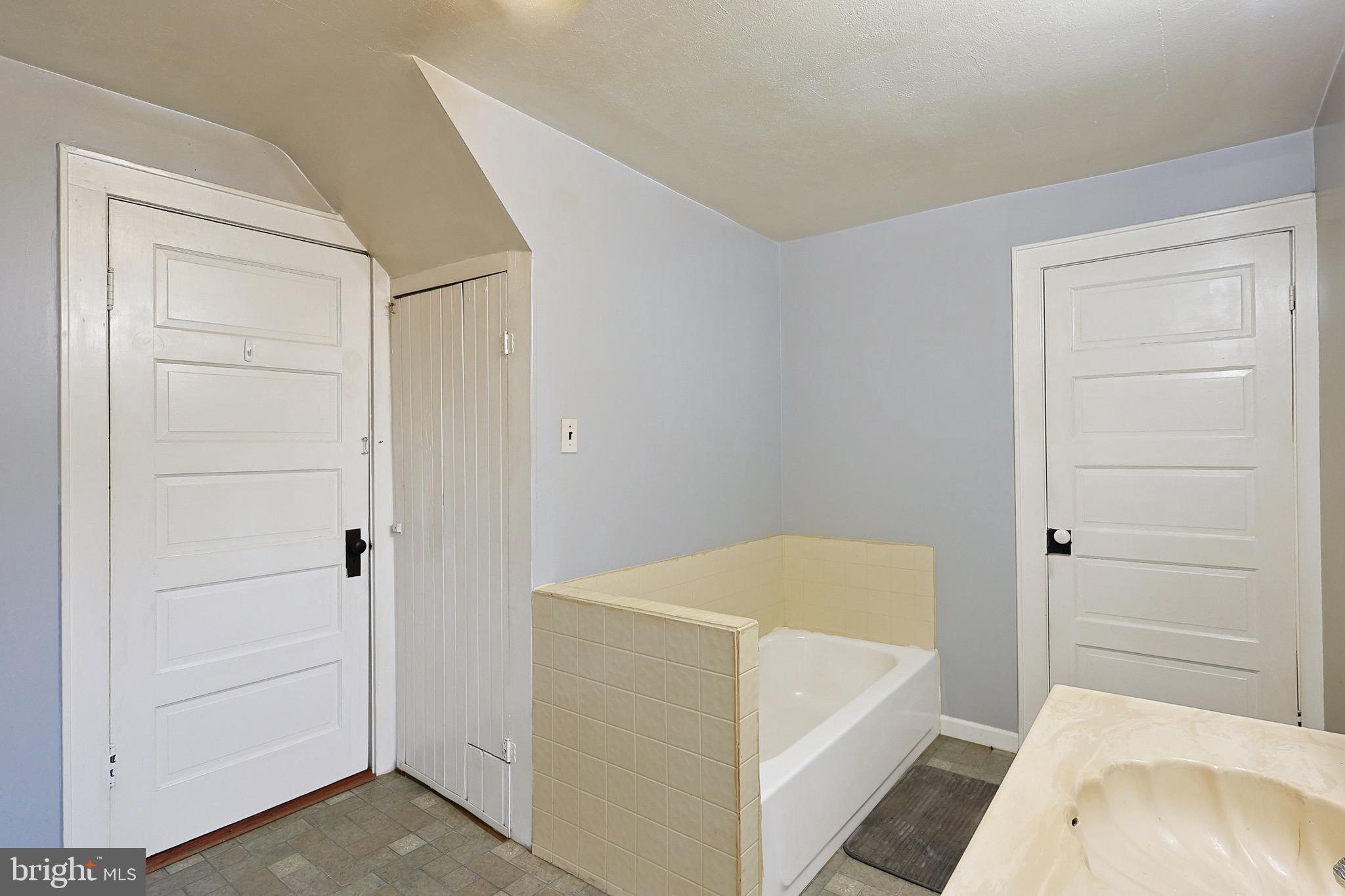 715 Charles Street Romney, WV 26757 - Photo 28 of 44 a bathroom with a tub and shower