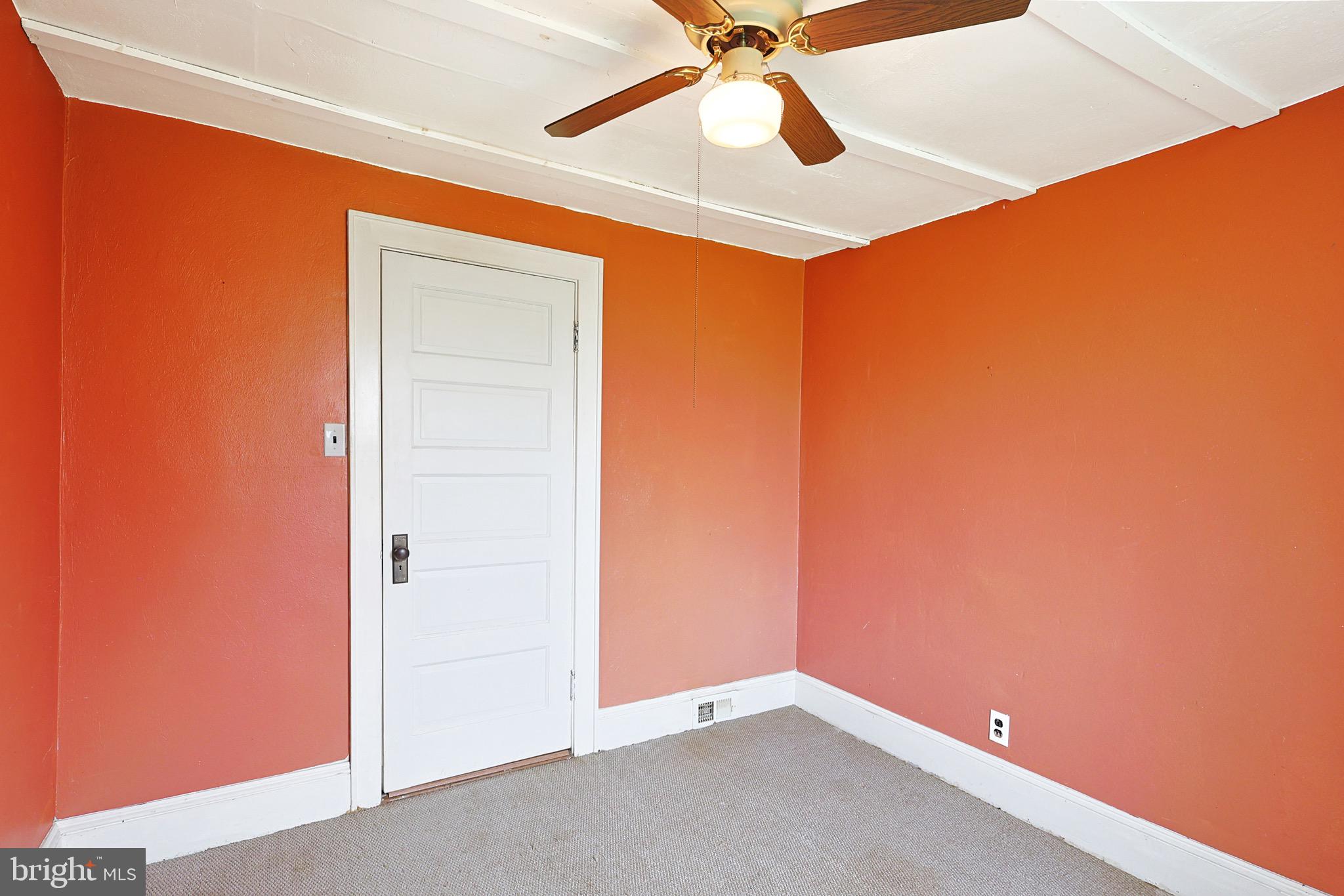 715 Charles Street Romney, WV 26757 - Photo 31 of 44 an empty room with a ceiling fan and a window