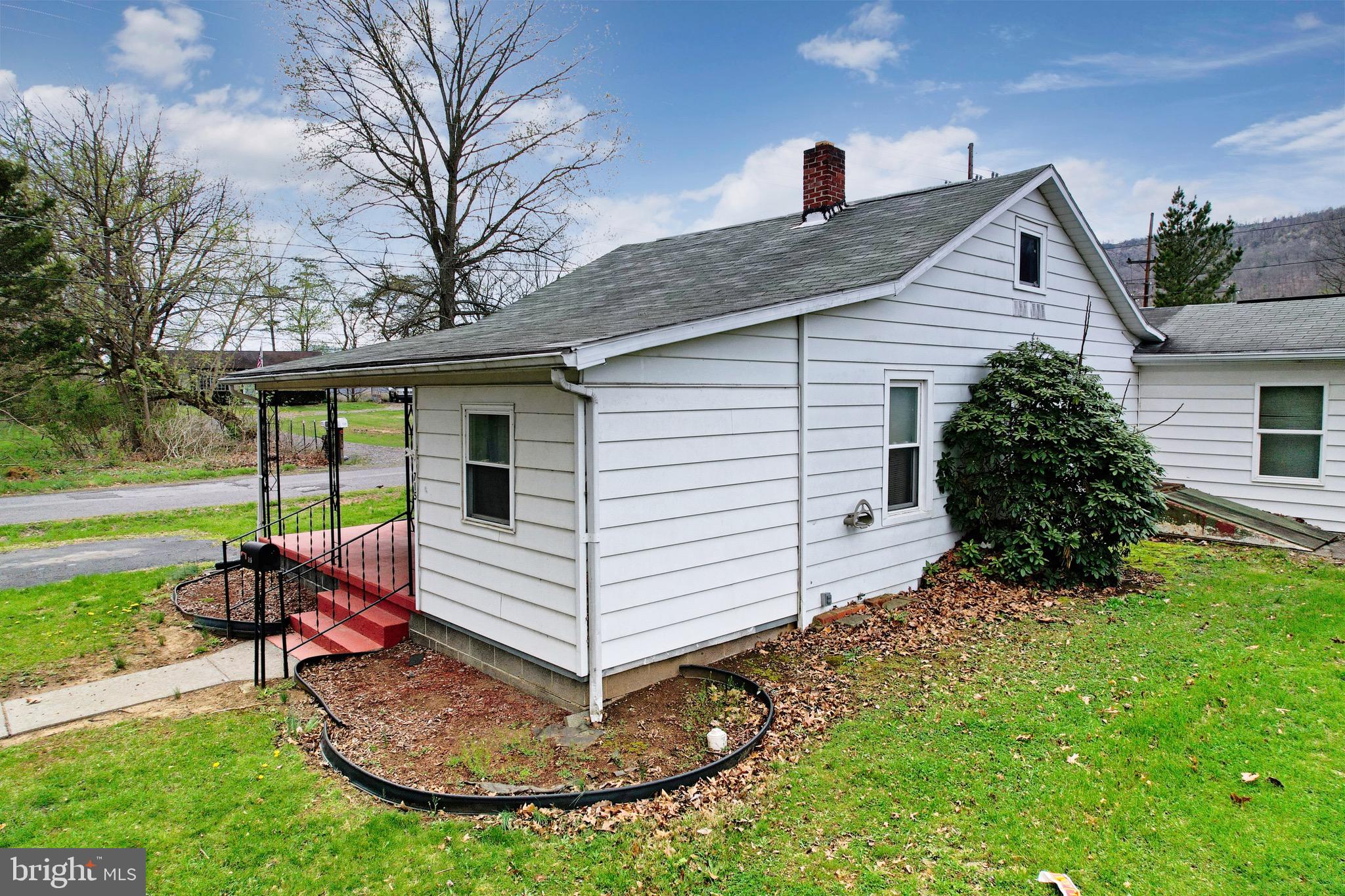 715 Charles Street Romney, WV 26757 - Photo 42 of 44 a front view of a house with a yard