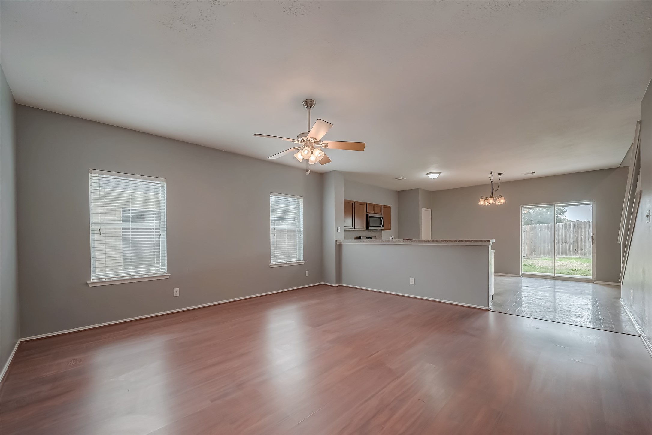 6211 Borage Street Crosby, TX 77532 - Photo 11 of 43 a view of an empty room with a window and wooden floor