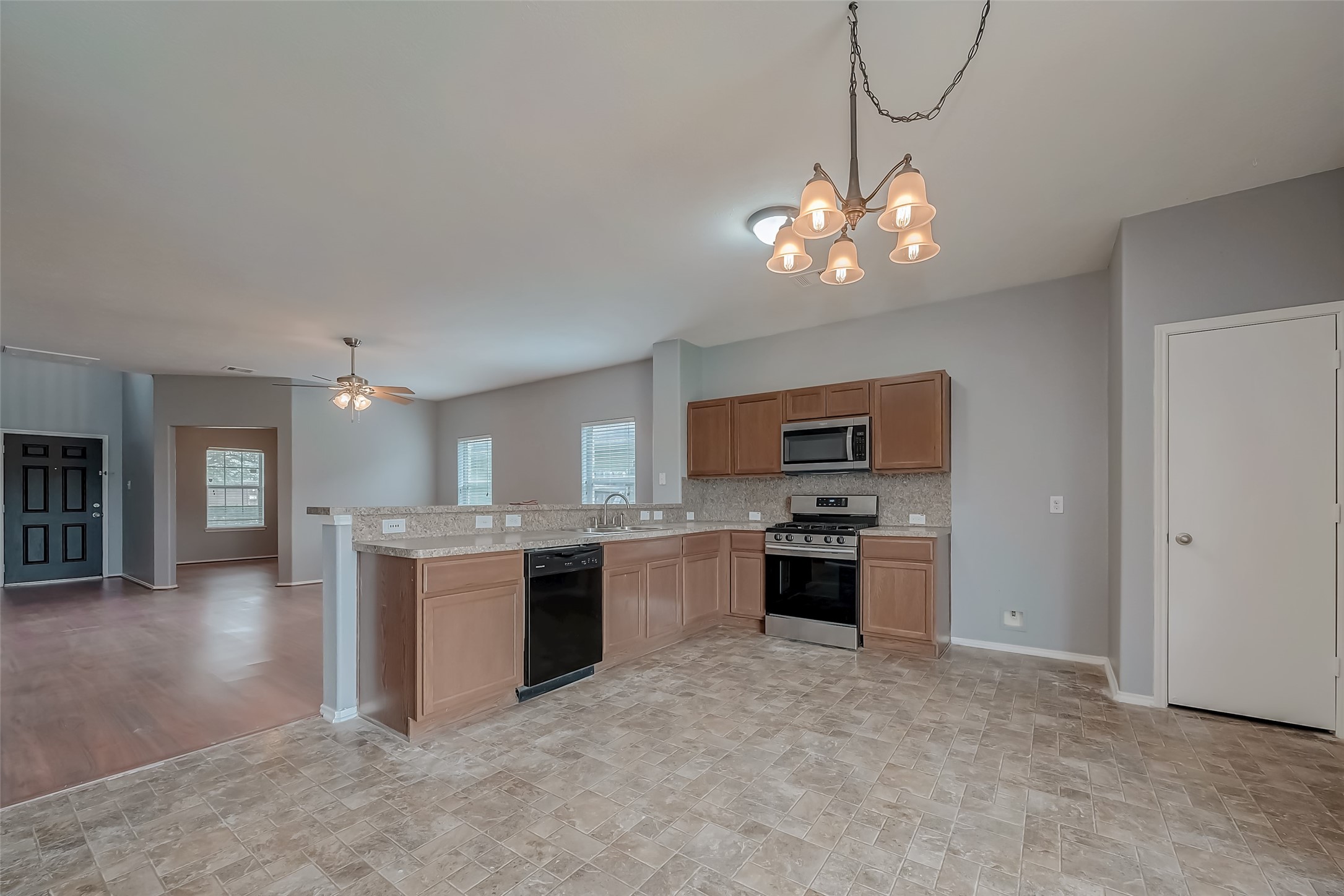 6211 Borage Street Crosby, TX 77532 - Photo 20 of 43 a kitchen with a refrigerator and stove