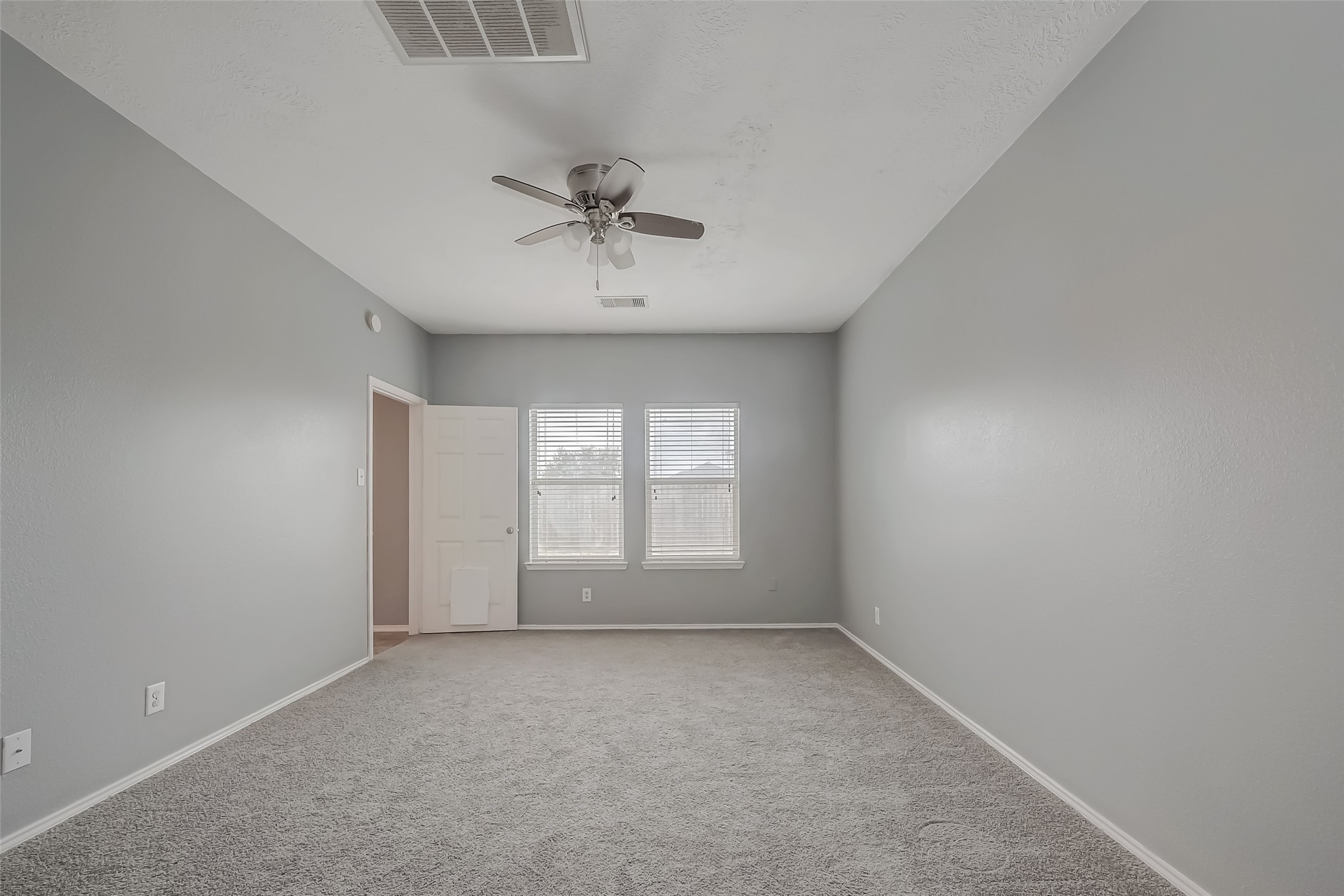 6211 Borage Street Crosby, TX 77532 - Photo 26 of 43 a view of room with a ceiling fan and window