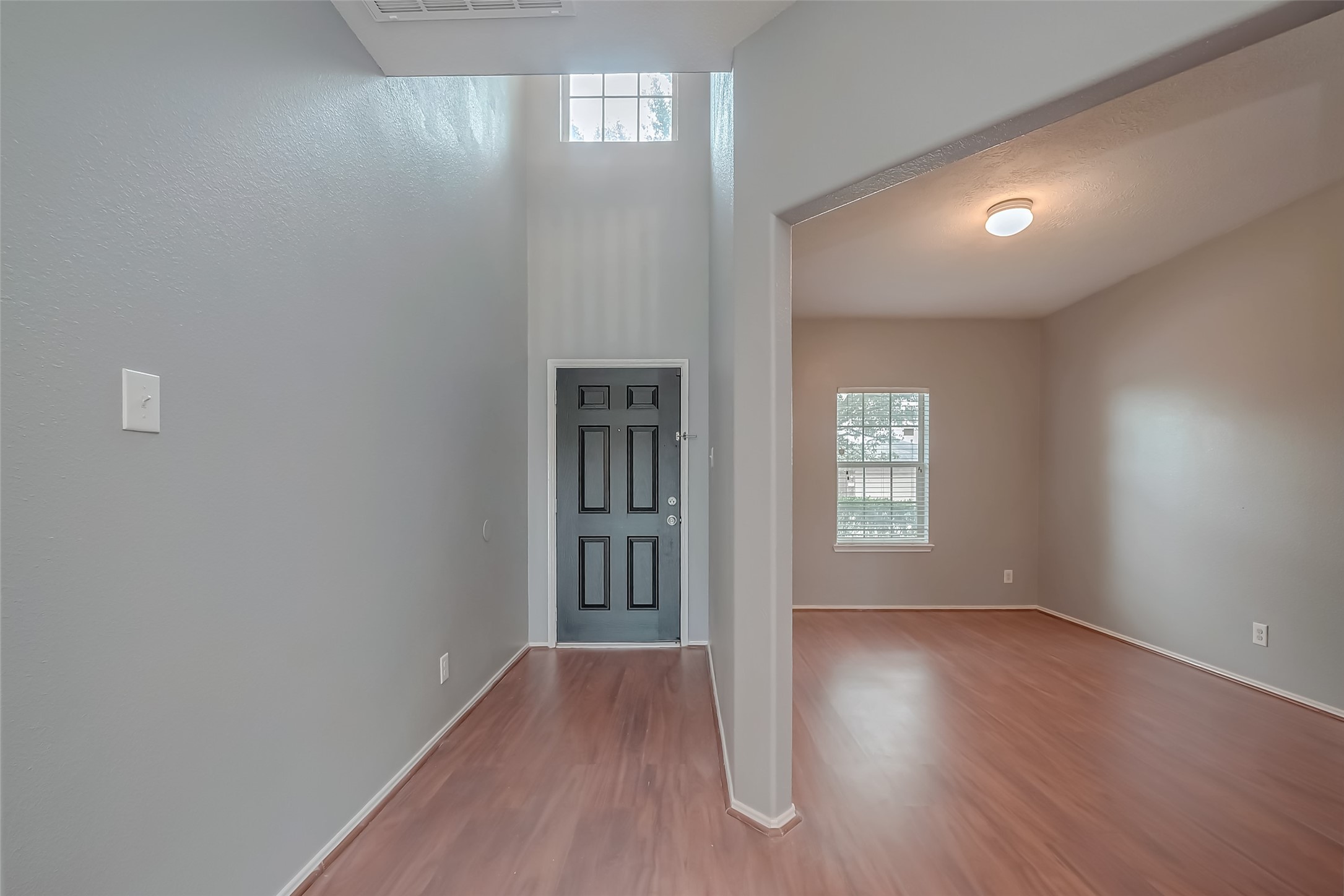 6211 Borage Street Crosby, TX 77532 - Photo 6 of 43 wooden floor in an empty room with a window