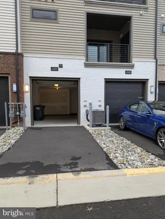 a front view of a house with parking space
