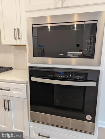 a bathroom with a stove and a microwave