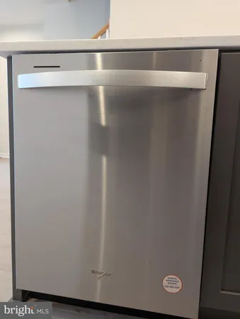 a white toilet sitting next to a shower