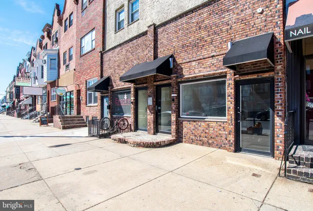 a view of a building with sitting area
