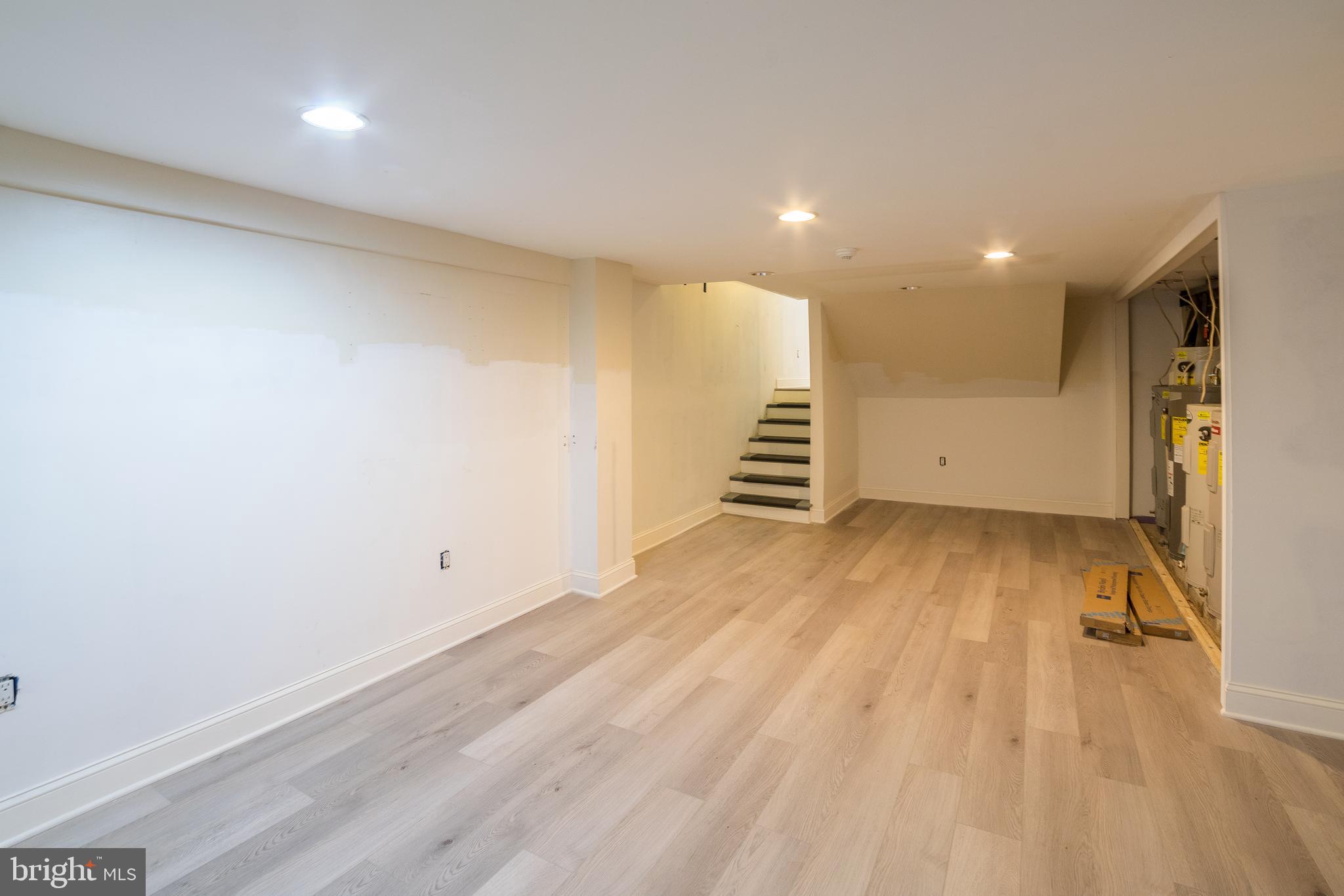 2504 South Broad Street, Unit COMMERCIAL Philadelphia, PA 19145 - Photo 10 of 11 an empty room with wooden floor and windows
