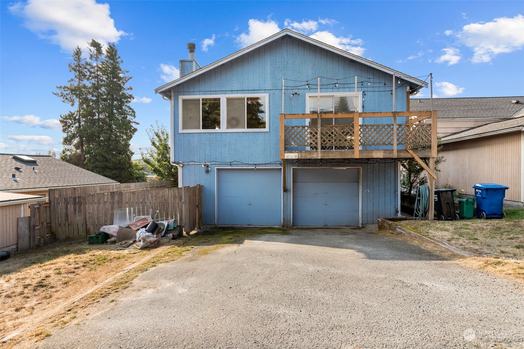 1306 North 100th Street Seattle, WA 98133 - Photo 2 of 2 a view of a house with a yard and garage