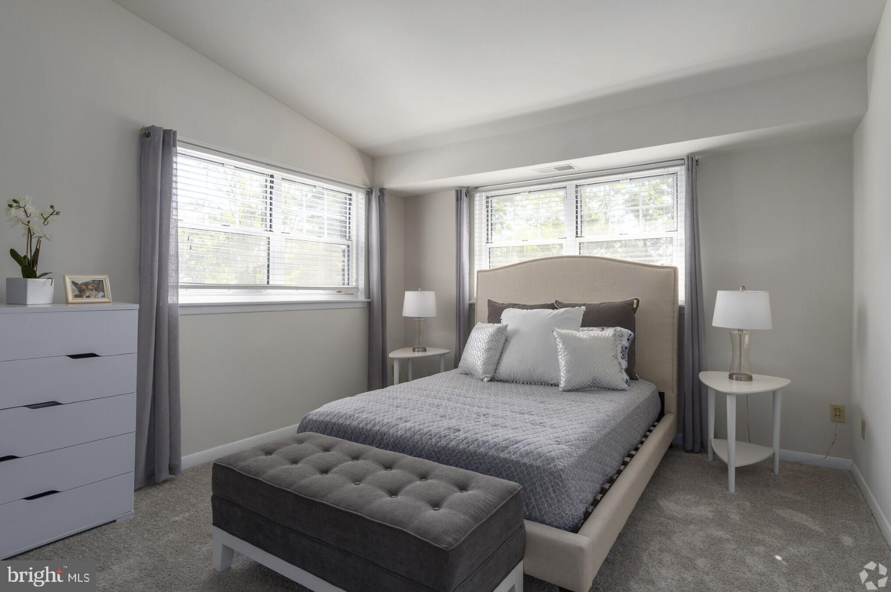 284 Iven Avenue, Unit 1B2783D Radnor, PA 19087 - Photo 11 of 12 a bedroom with a bed and a window