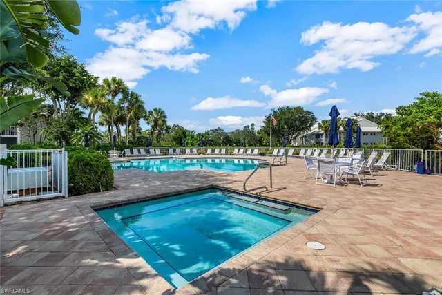 a view of a swimming pool with a lounge chair