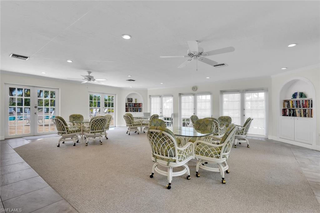 780 Willowbrook Drive, Unit 707 Naples, FL 34108 - Photo 32 of 36 a view of a dining room with furniture window and outside view