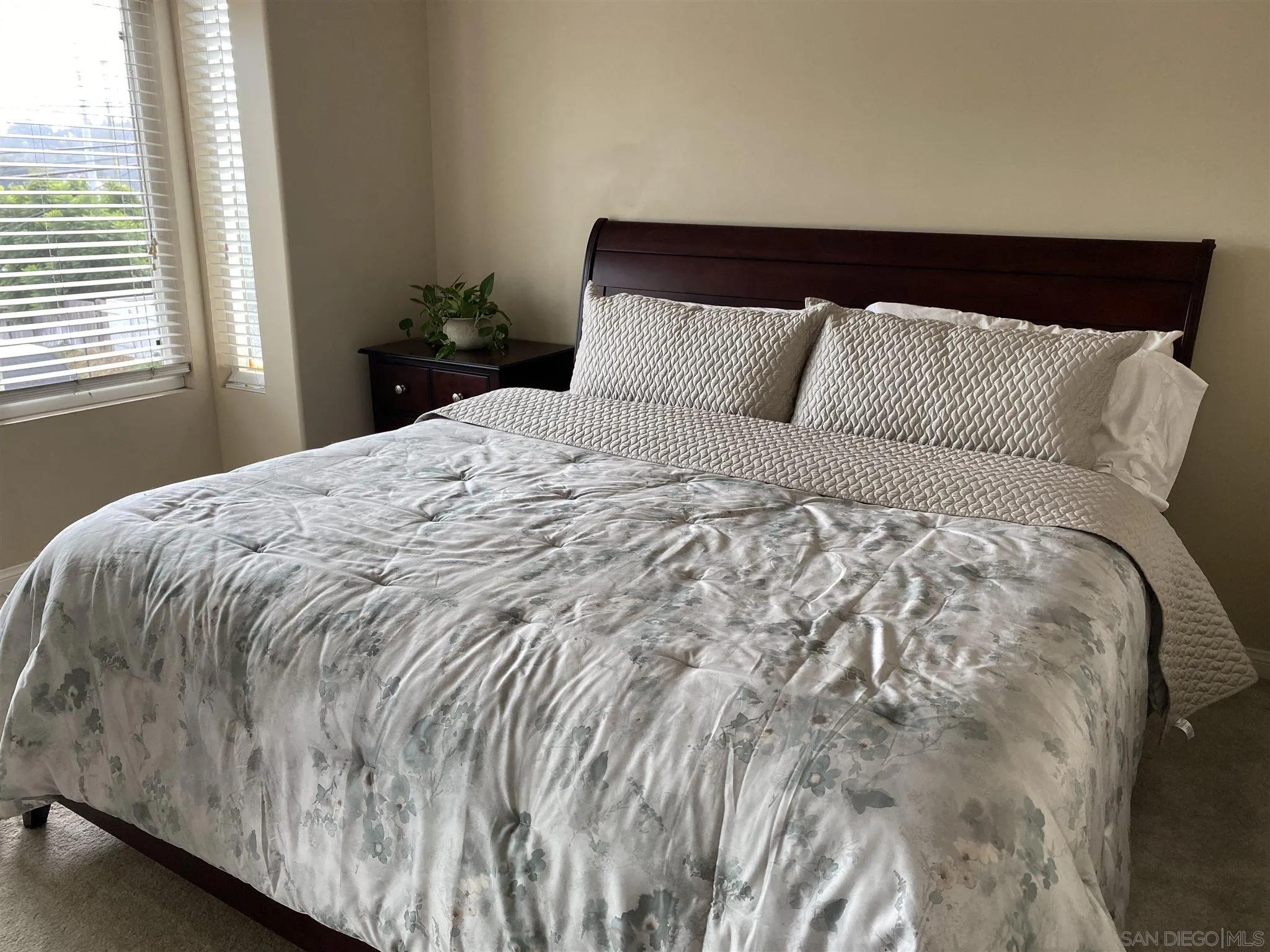 5722 Riley Street, Unit 3 San Diego, CA 92110 - Photo 12 of 14 a bedroom with a bed and window