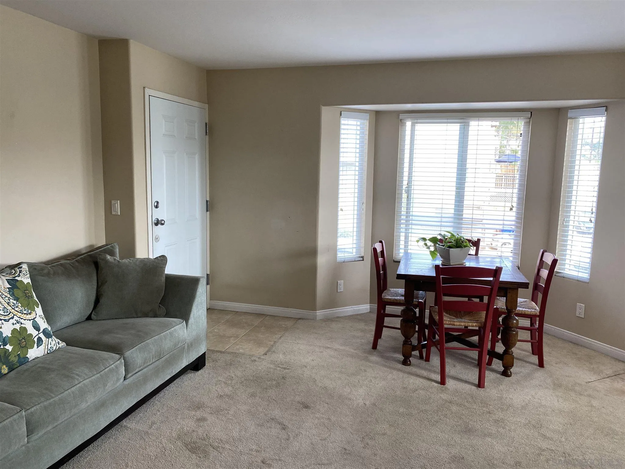 5722 Riley Street, Unit 3 San Diego, CA 92110 - Photo 14 of 14 a living room with furniture and a window