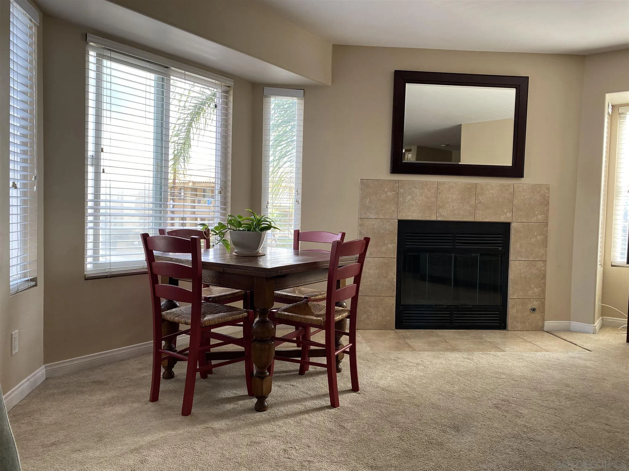 5722 Riley Street, Unit 3 San Diego, CA 92110 - Photo 3 of 14 a dining room with furniture and window