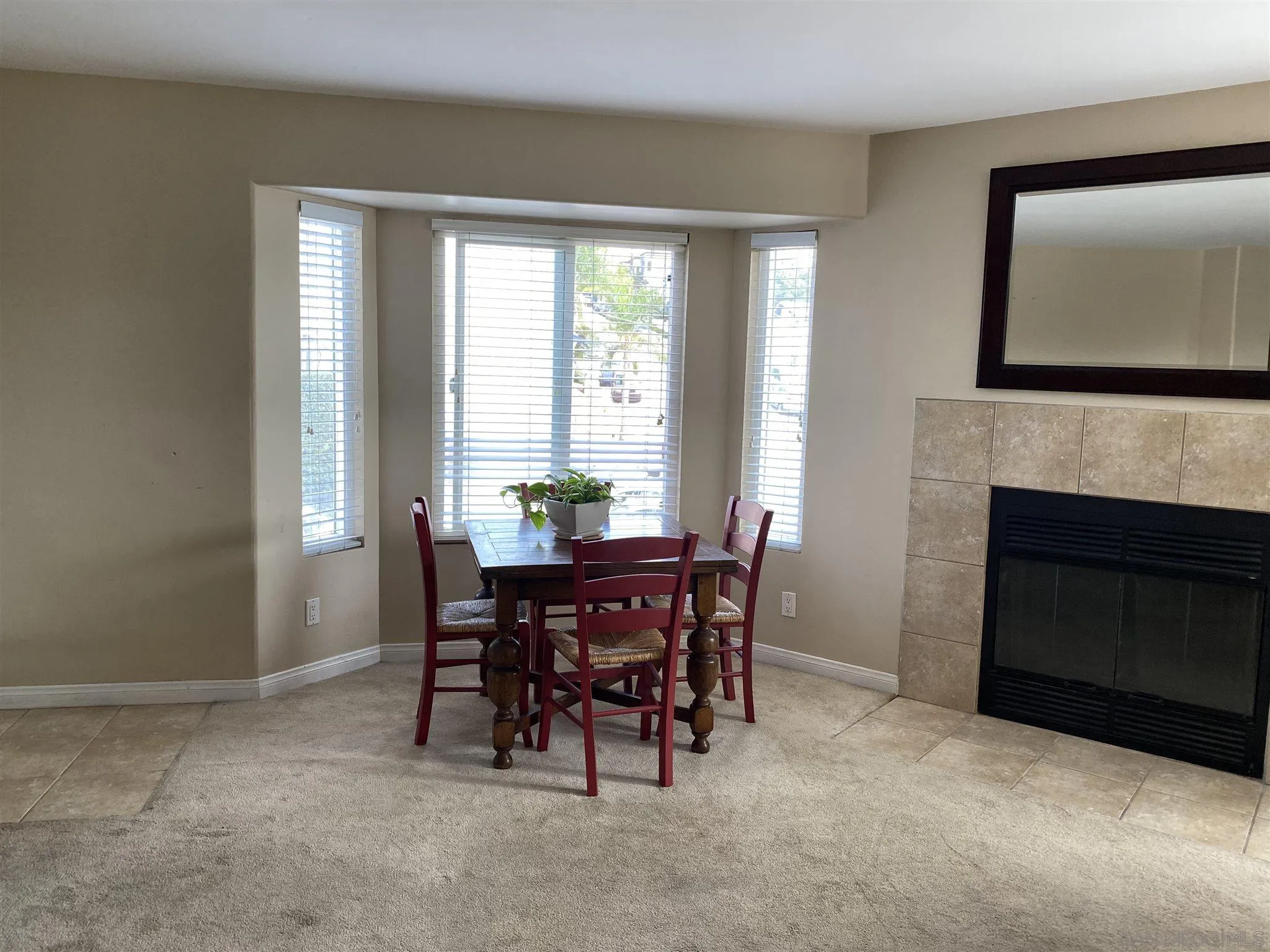 5722 Riley Street, Unit 3 San Diego, CA 92110 - Photo 4 of 14 a dining room with furniture and window