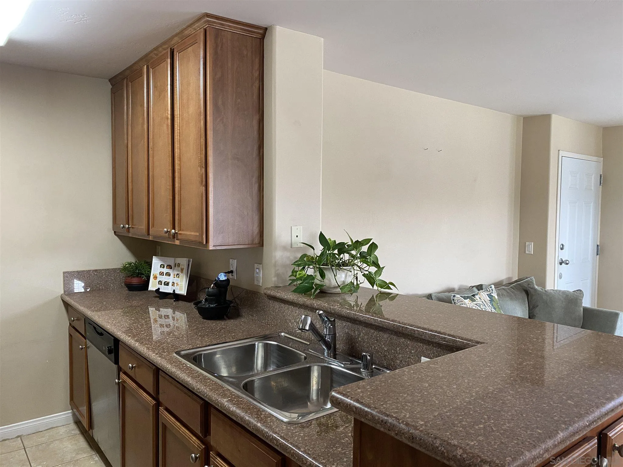 5722 Riley Street, Unit 3 San Diego, CA 92110 - Photo 6 of 14 a kitchen with a sink and a cabinets